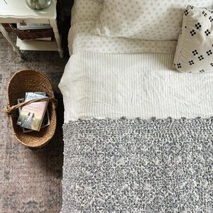 Garnet Hill white and blue floral quilt with pompoms